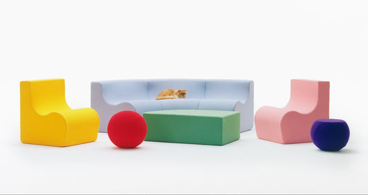 family. modular furniture collection by nara.world featuring six upholstered modular pieces including a sofa, armchairs, coffee table, side table, and footrest